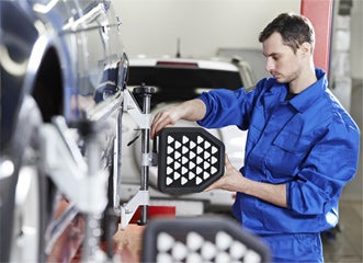 Service Technician working on a car