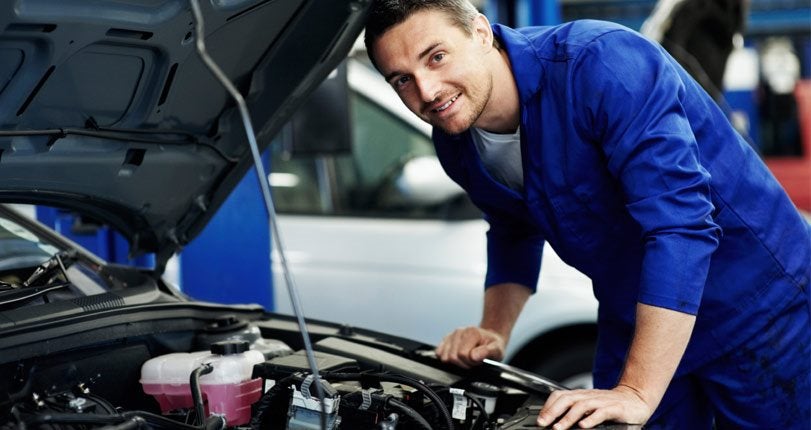 Tech Working on a Car